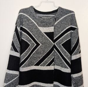 Black and white cardigan size Large buttons at the neck